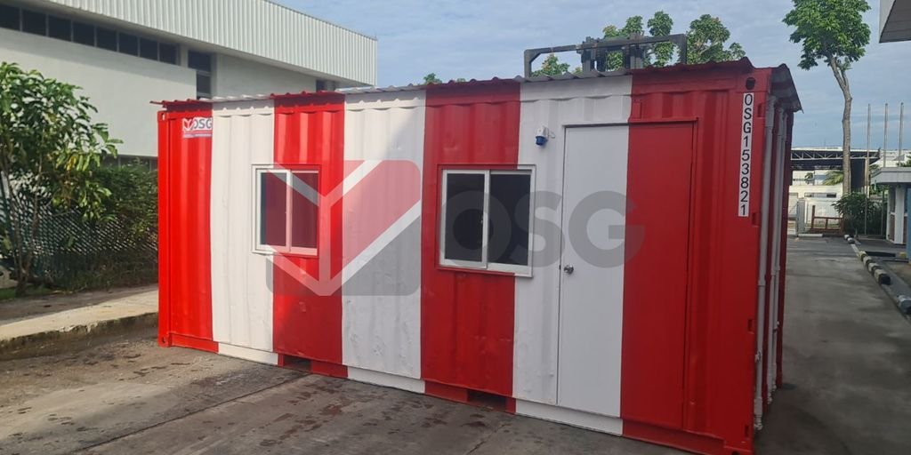 This image shows a red and white shipping container building.