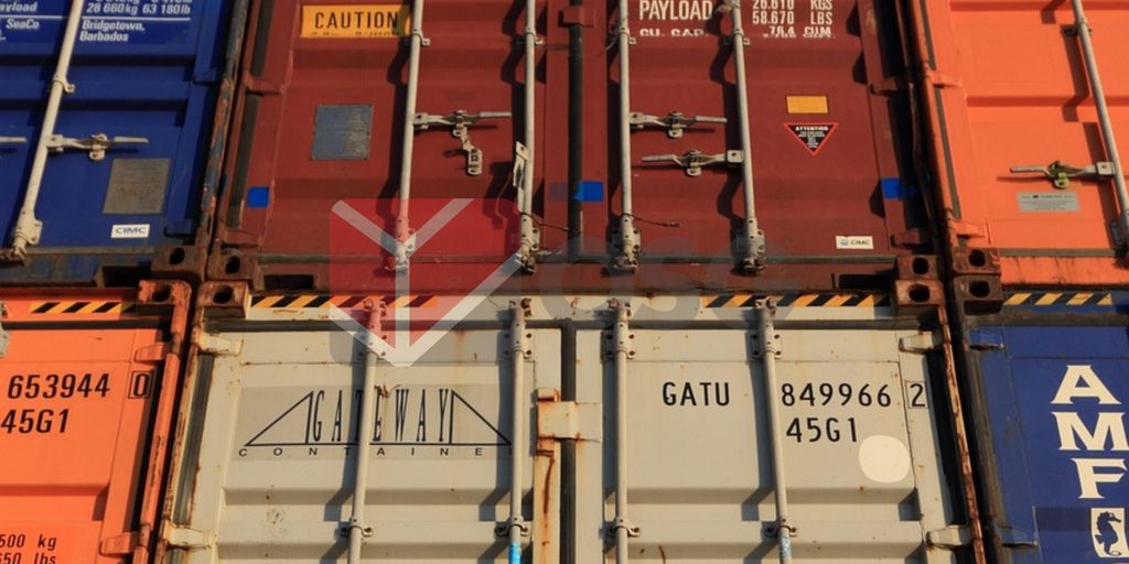 Stacked shipping containers in various colors and labels.