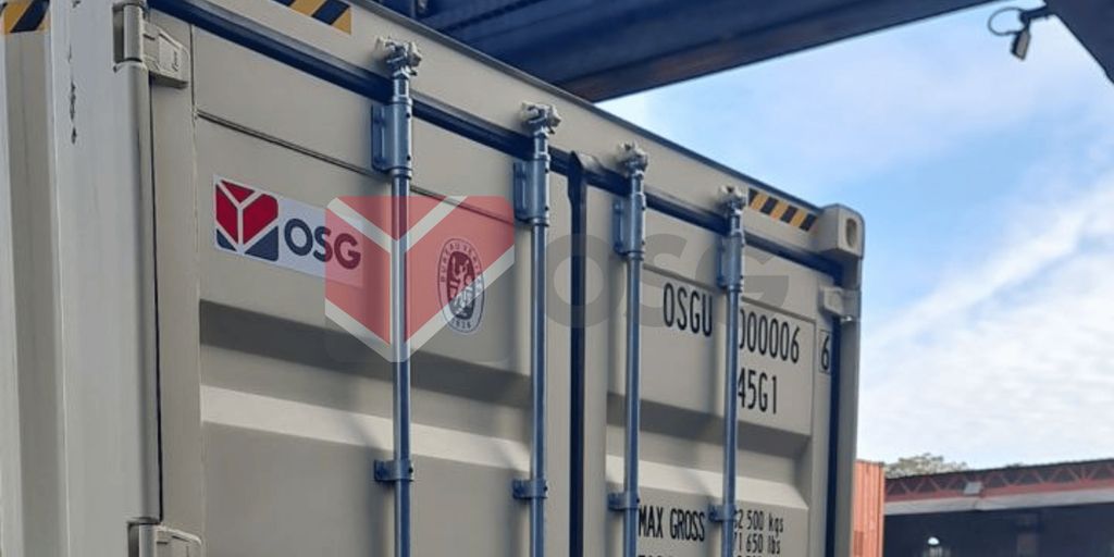 Shipping container with logos and details on its side.