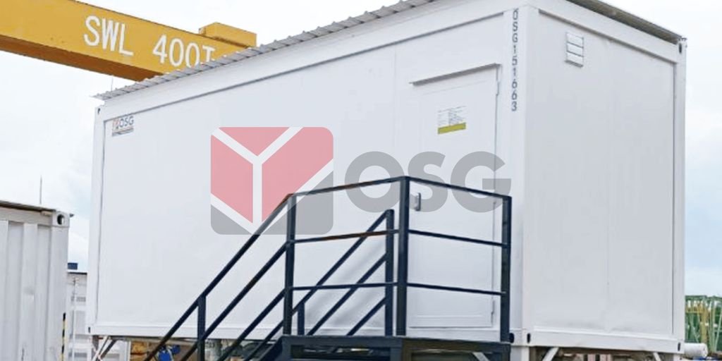 A white shipping container with a staircase for access.