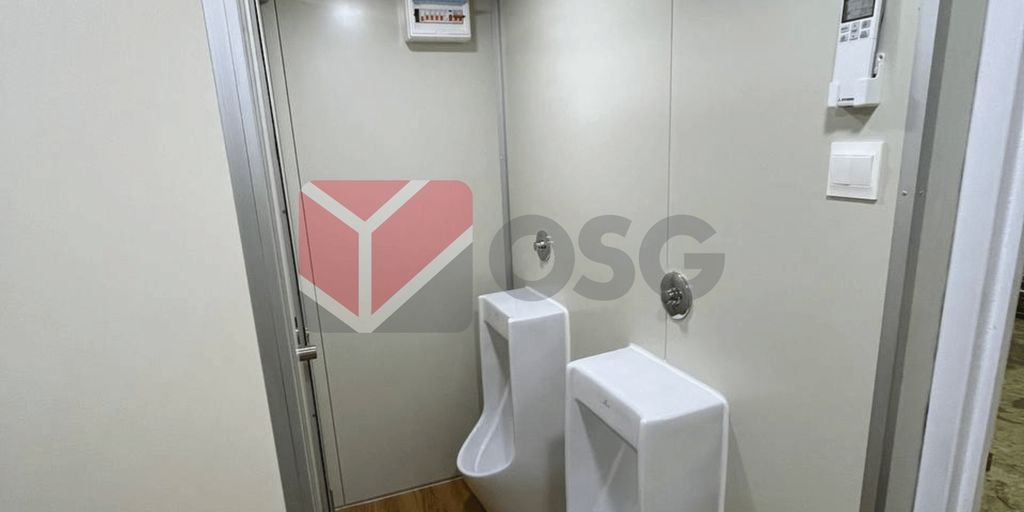 Two urinals in a clean, modern restroom environment.