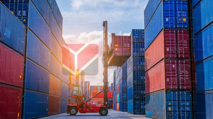 Forklift maneuvering containers in a colorful shipping yard.