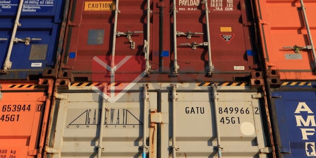 Stacked shipping containers in various colors and labels.