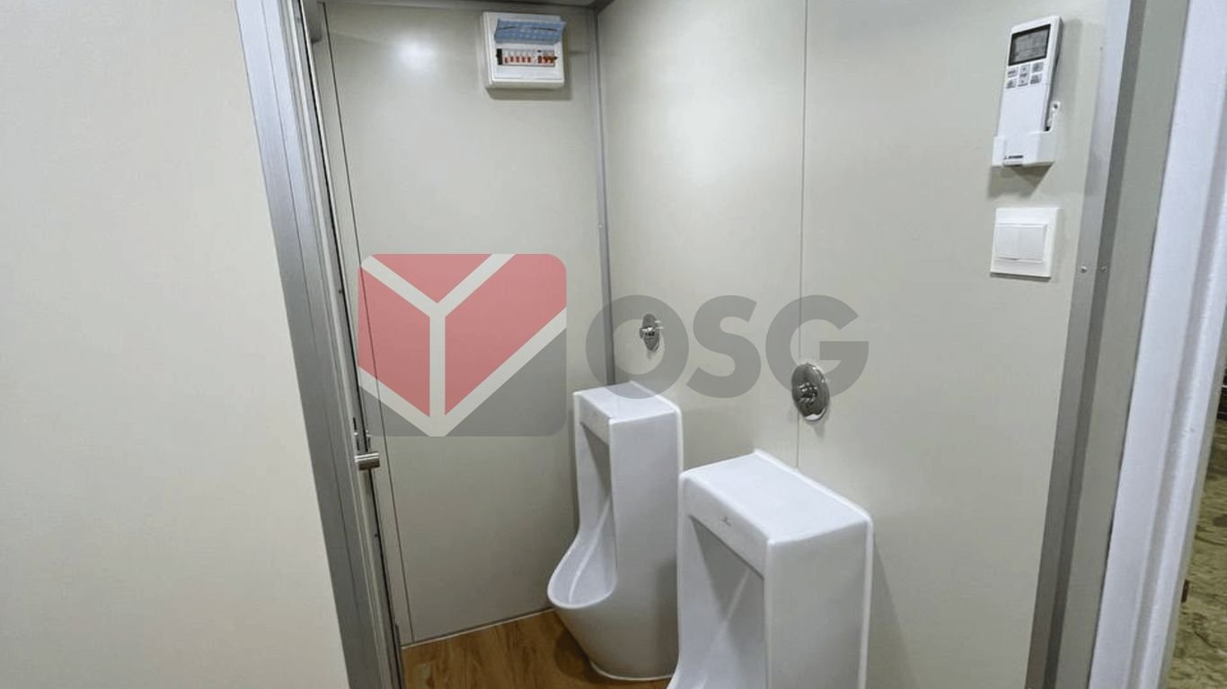 Two urinals in a clean, modern restroom environment.