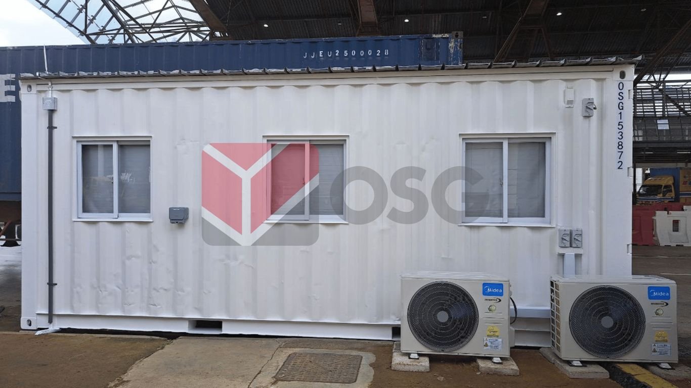 A white shipping container with windows and air conditioning units.