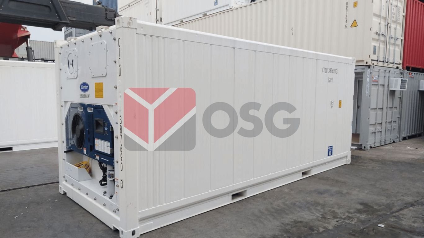 White shipping container with equipment, positioned on a dock.