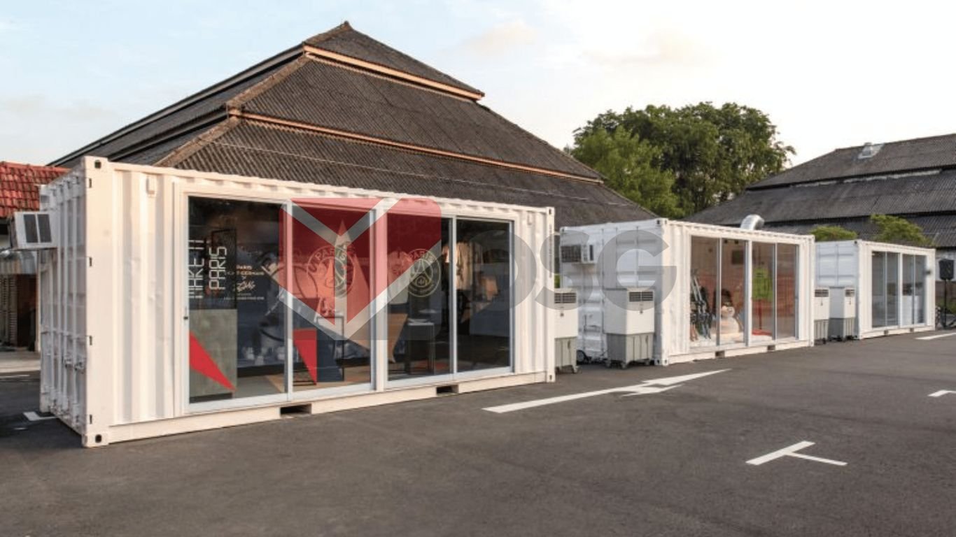 Modern shipping containers converted into retail spaces in a street.