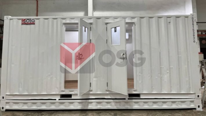 White shipping container with double doors, minimalist interior design.