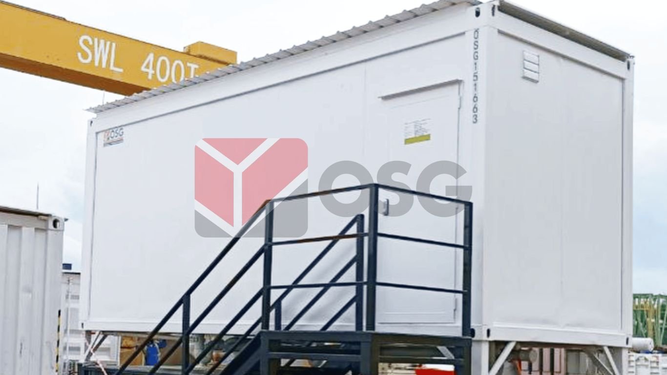 A white shipping container with a staircase for access.