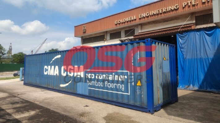 A blue shipping container with CMA CGM logo and text.