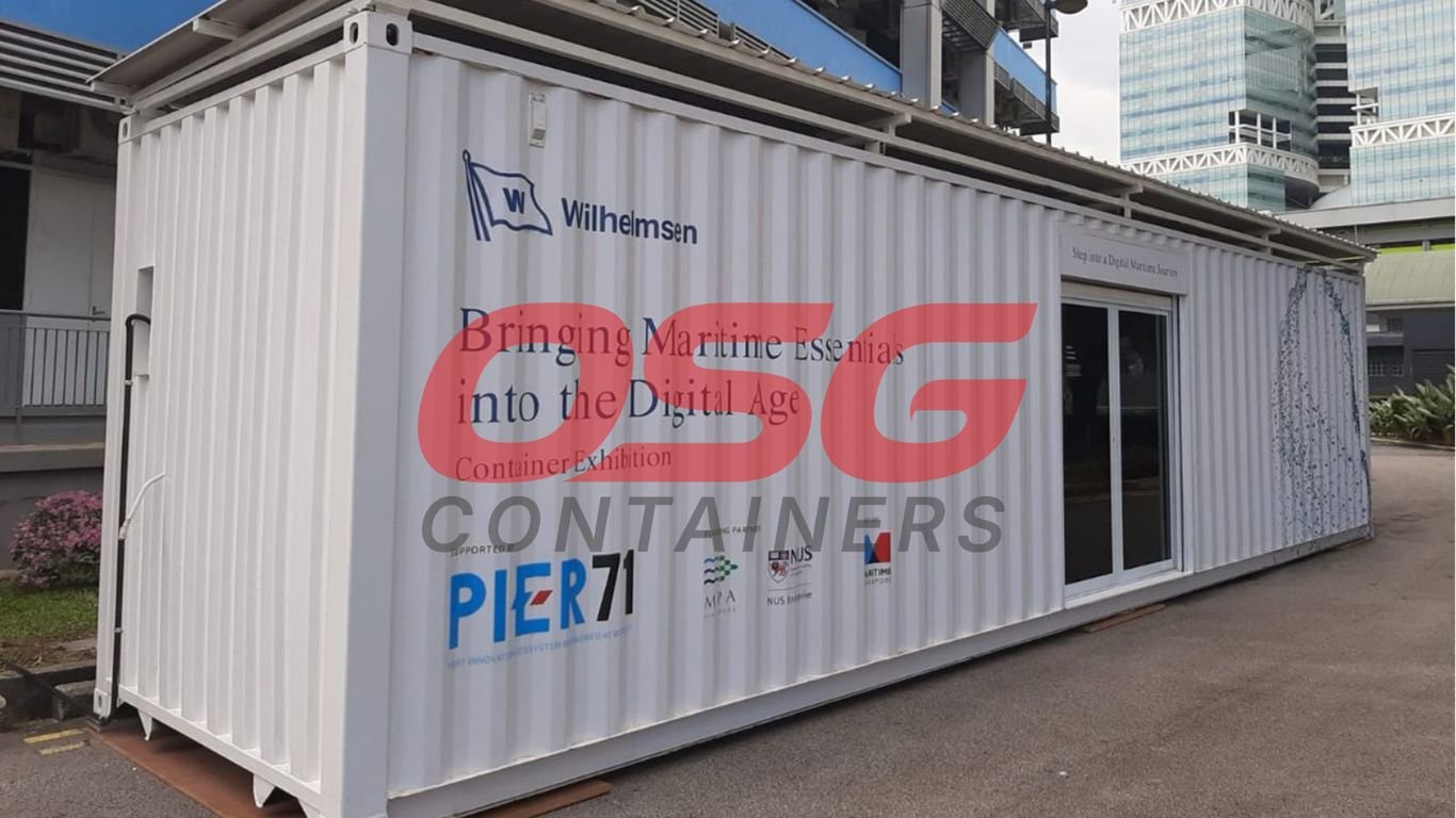 White shipping container exhibition with text about maritime and digital age.