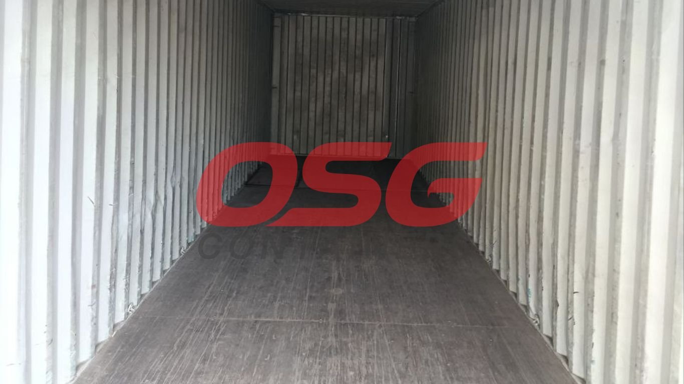 Inside view of an empty shipping container with corrugated walls.
