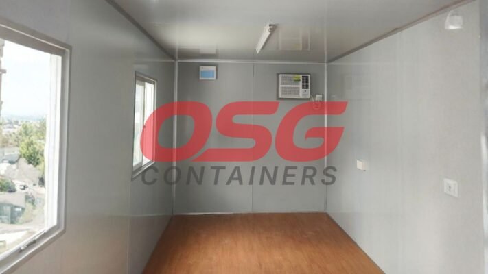 Interior of a portable container with windows and air conditioning.