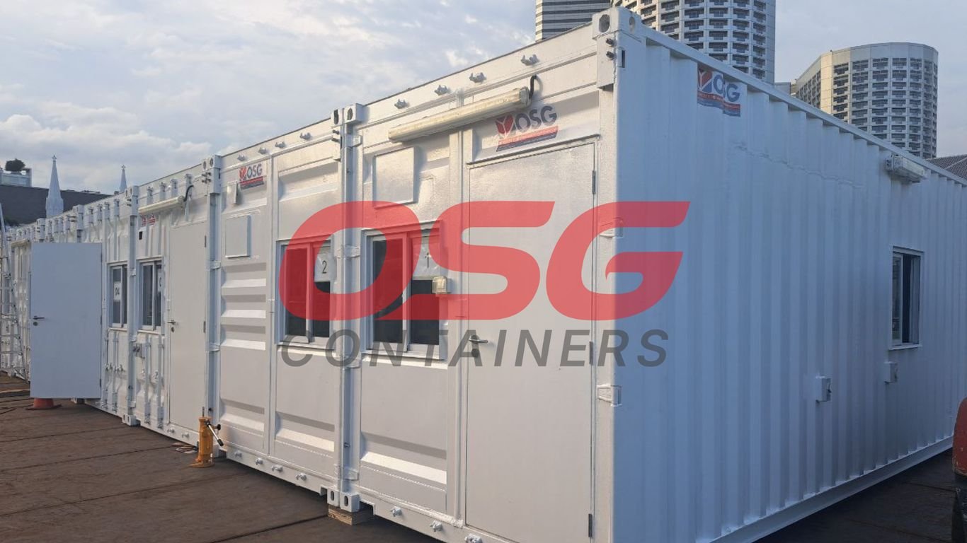 White modular containers with windows and doors, OSG logo.