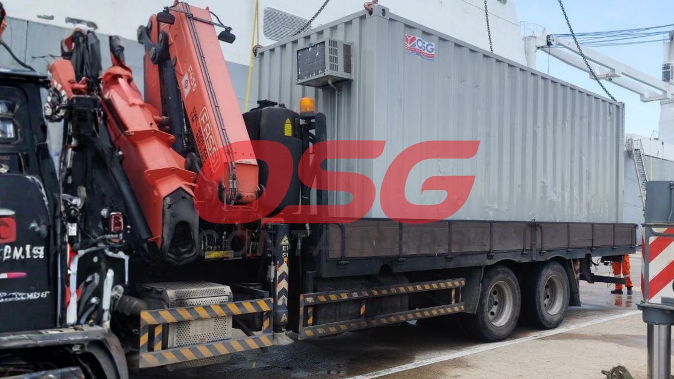 A blue and white shipping container office with windows and a door.