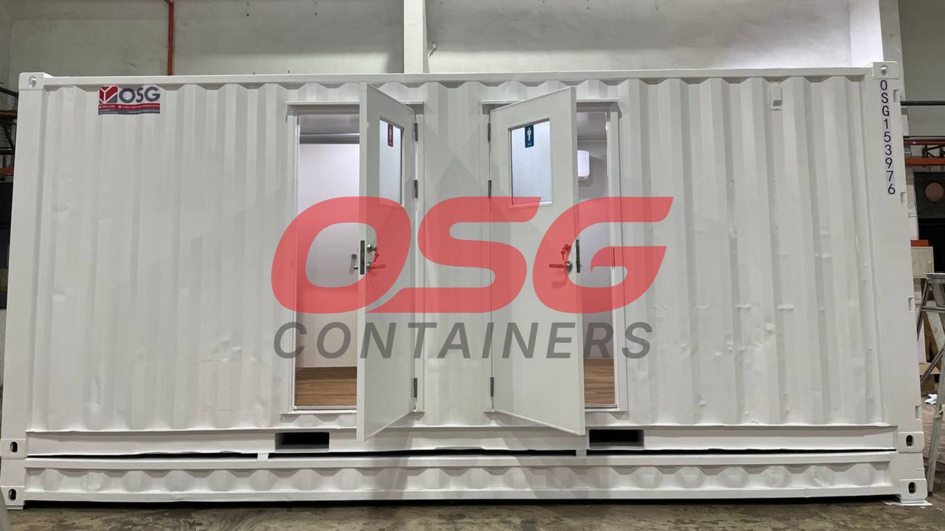 White shipping container with multiple doors and windows, labeled OSG.
