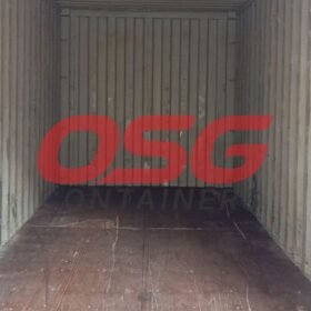 Inside view of an empty shipping container with wooden floor.