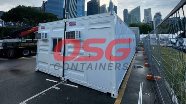 White modular container units with air conditioners and windows.