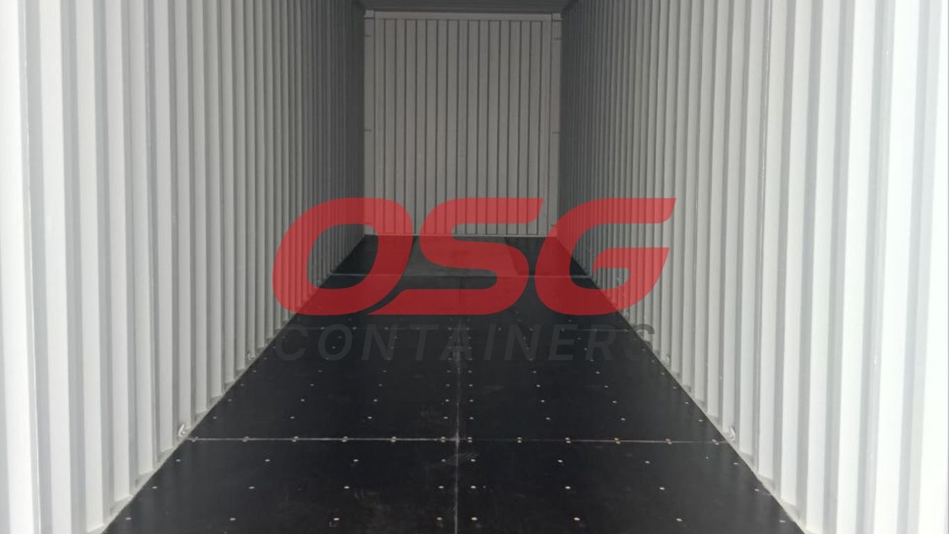 Inside view of an empty shipping container with a logo.
