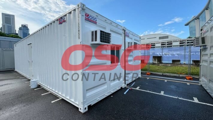 White shipping container office with air conditioning units.