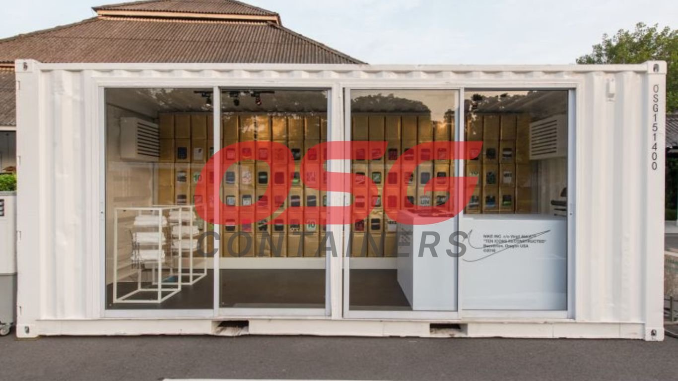 A white shipping container converted into a retail store with products displayed inside.