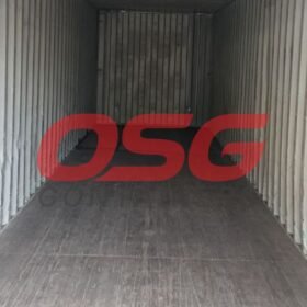 Inside view of an empty shipping container with corrugated walls.