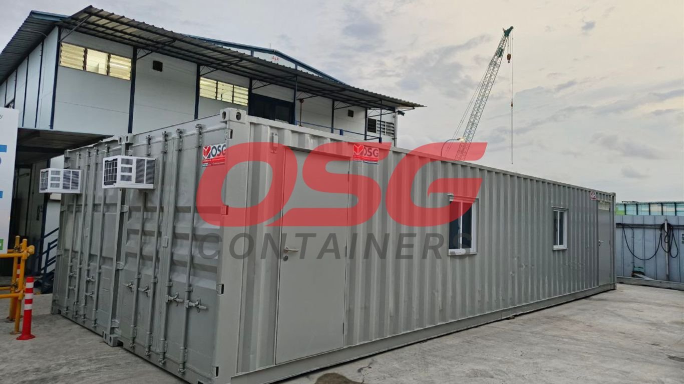 Shipping container converted into a small office with air conditioning units.