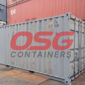 OSG Containers logo on a shipping container in a yard.