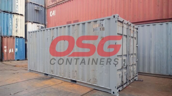 OSG Containers logo on a shipping container in a yard.