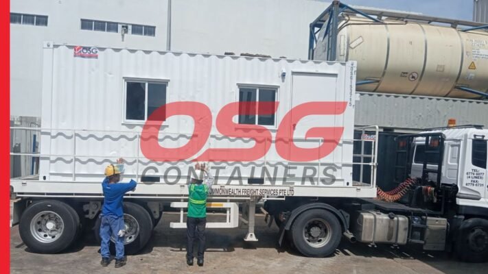 White container office on a truck with workers.