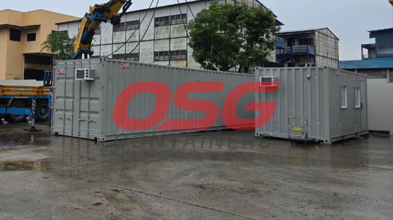 Crane lifting shipping containers at a facility.