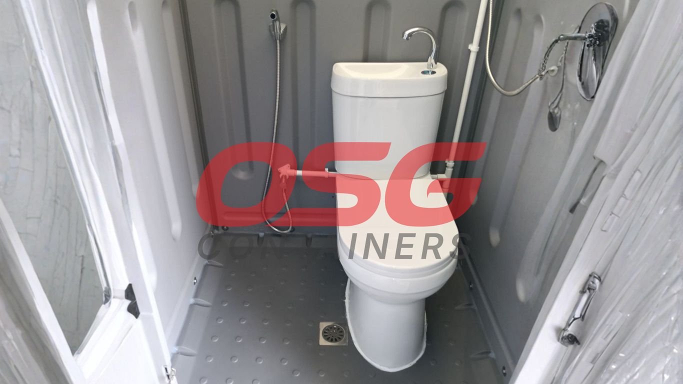 Compact portable toilet and shower unit with sink and bidet sprayer.
