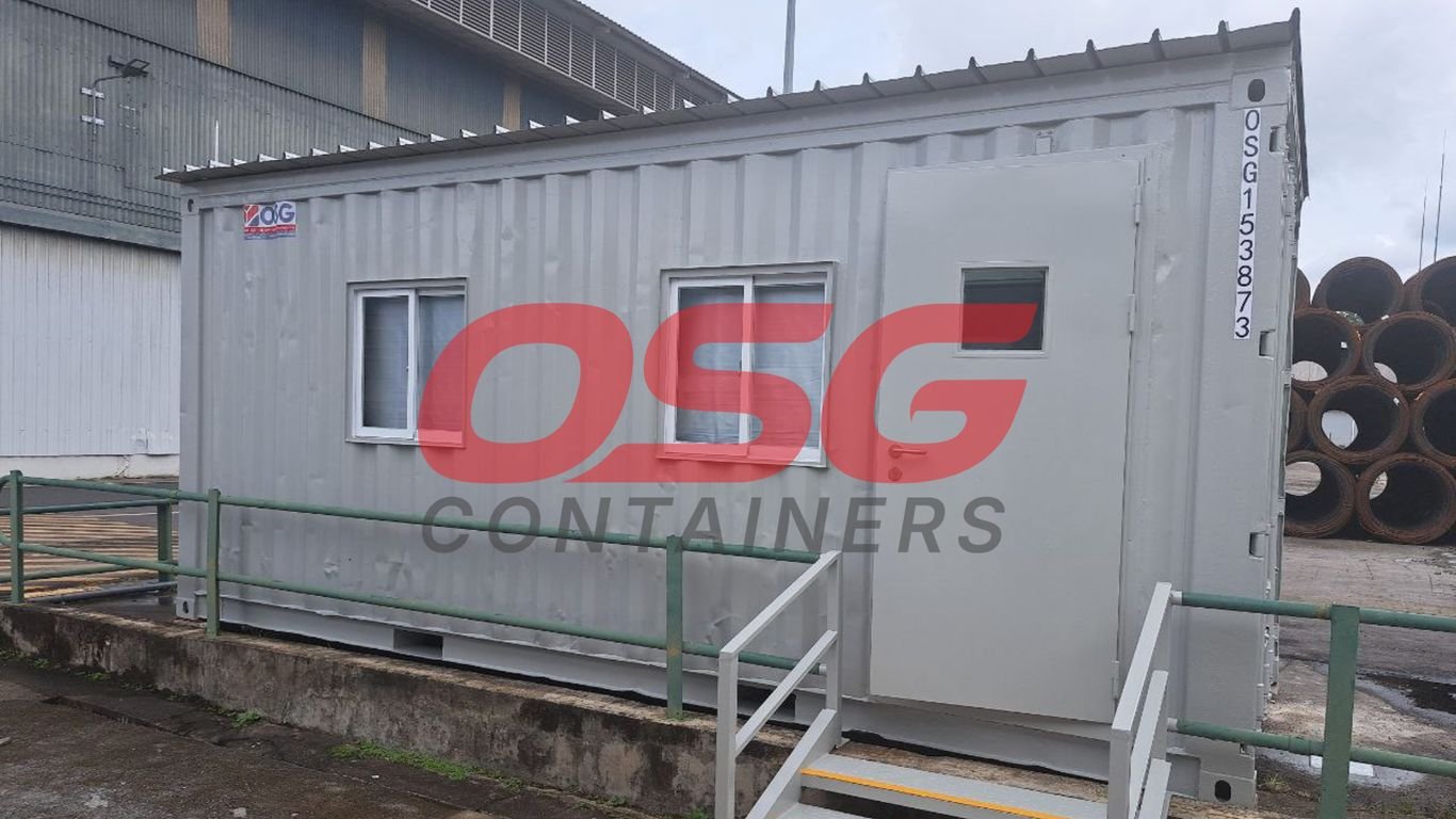 A grey shipping container converted into an office space.