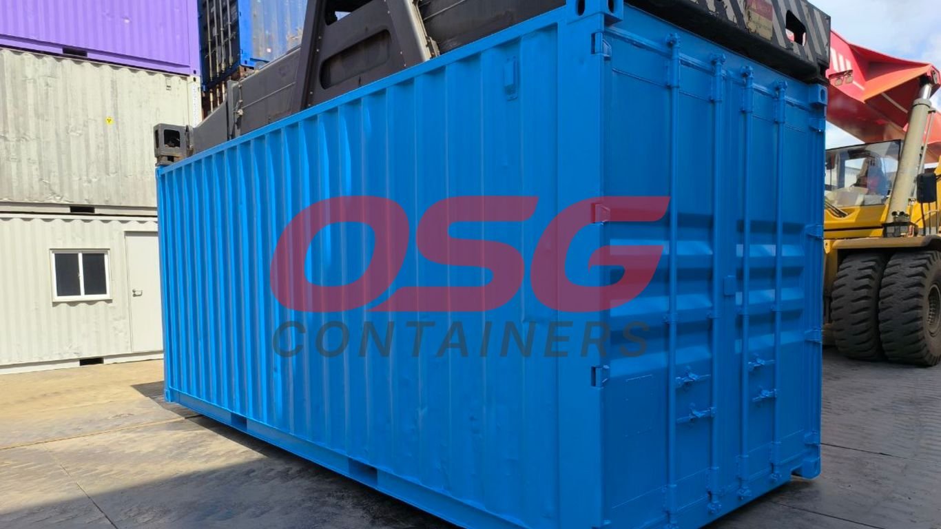 Blue shipping container with OSG logo, forklift in background.