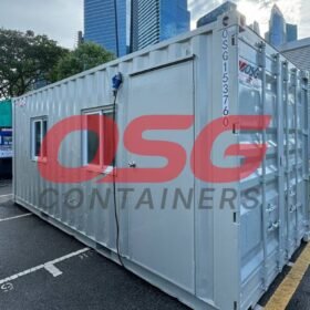 A portable container office with a window and door.