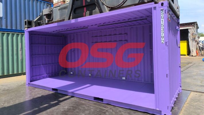 A purple shipping container with shelves inside, outdoors.