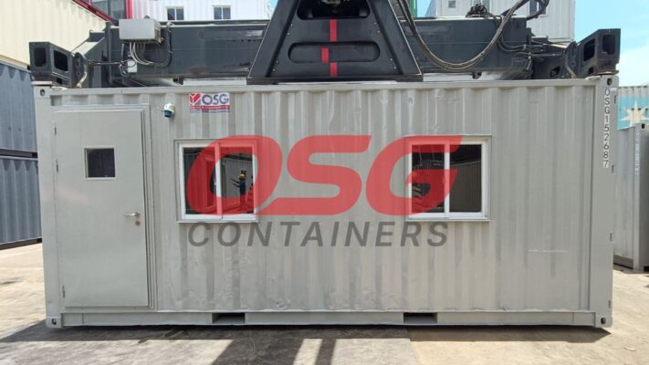 A shipping container office with windows and a door.