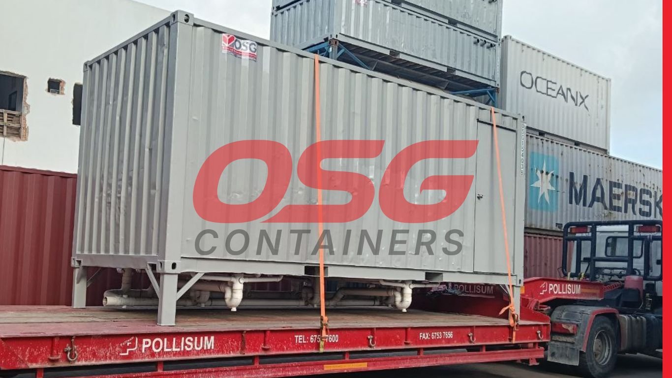 Shipping containers stacked on a flatbed truck, ready for transport.