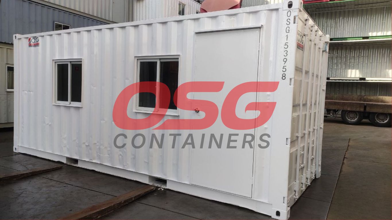 White shipping container office with windows and door.