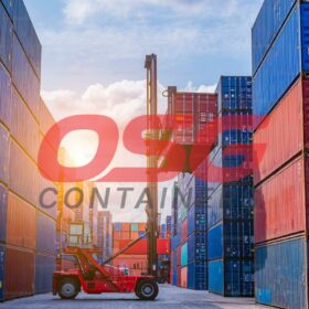 Rows of shipping containers are stacked high at a port.