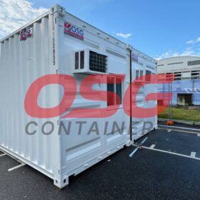 White shipping container office with air conditioning units.