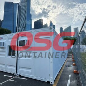 Modular containers with air conditioning units in a city setting.