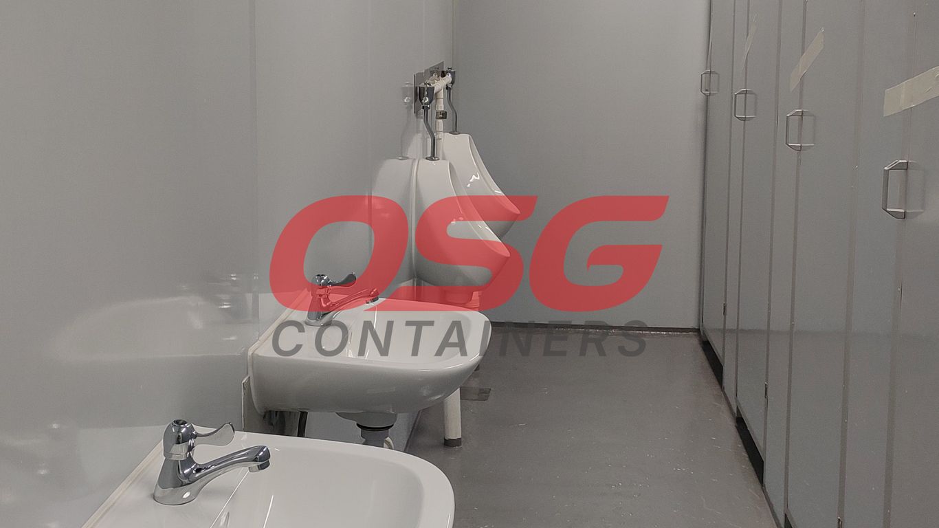 A clean, modern restroom with sinks and urinals.