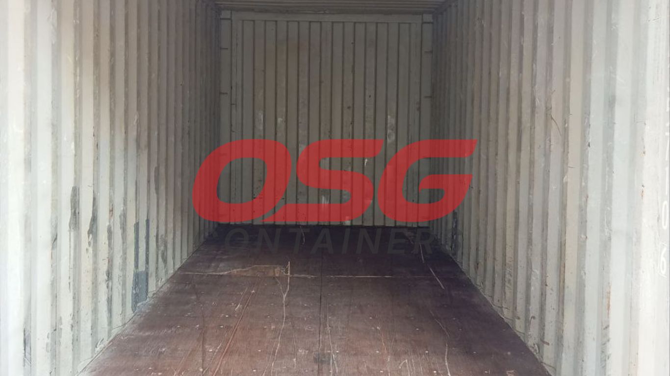 Inside view of an empty shipping container with wooden floor.
