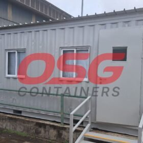 A grey shipping container converted into an office space.