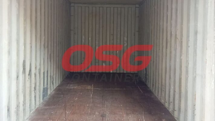 Inside view of an empty shipping container with wooden floor.