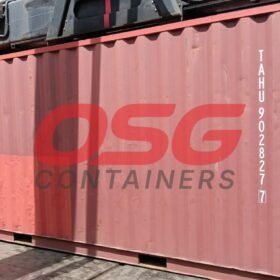 Red shipping container with OSG Containers logo and markings.