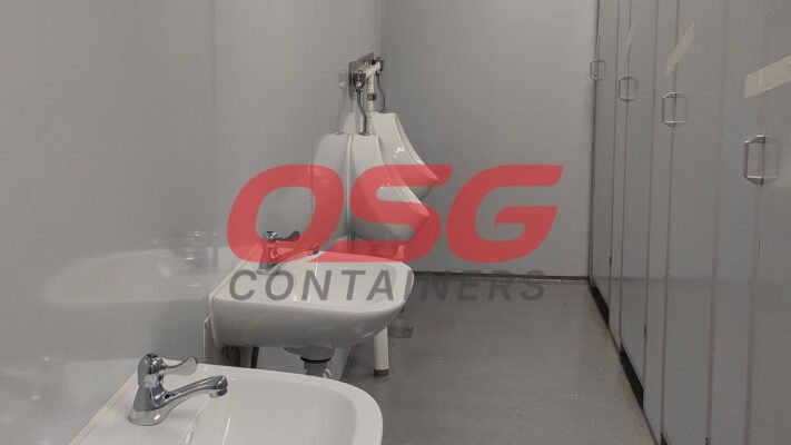 A clean, modern restroom with sinks and urinals.