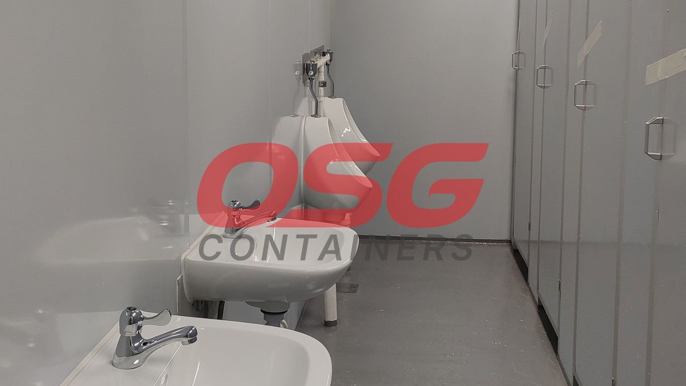 A clean, modern restroom with sinks and urinals.