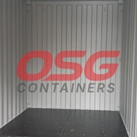 Interior of an empty shipping container with OSG Containers logo.